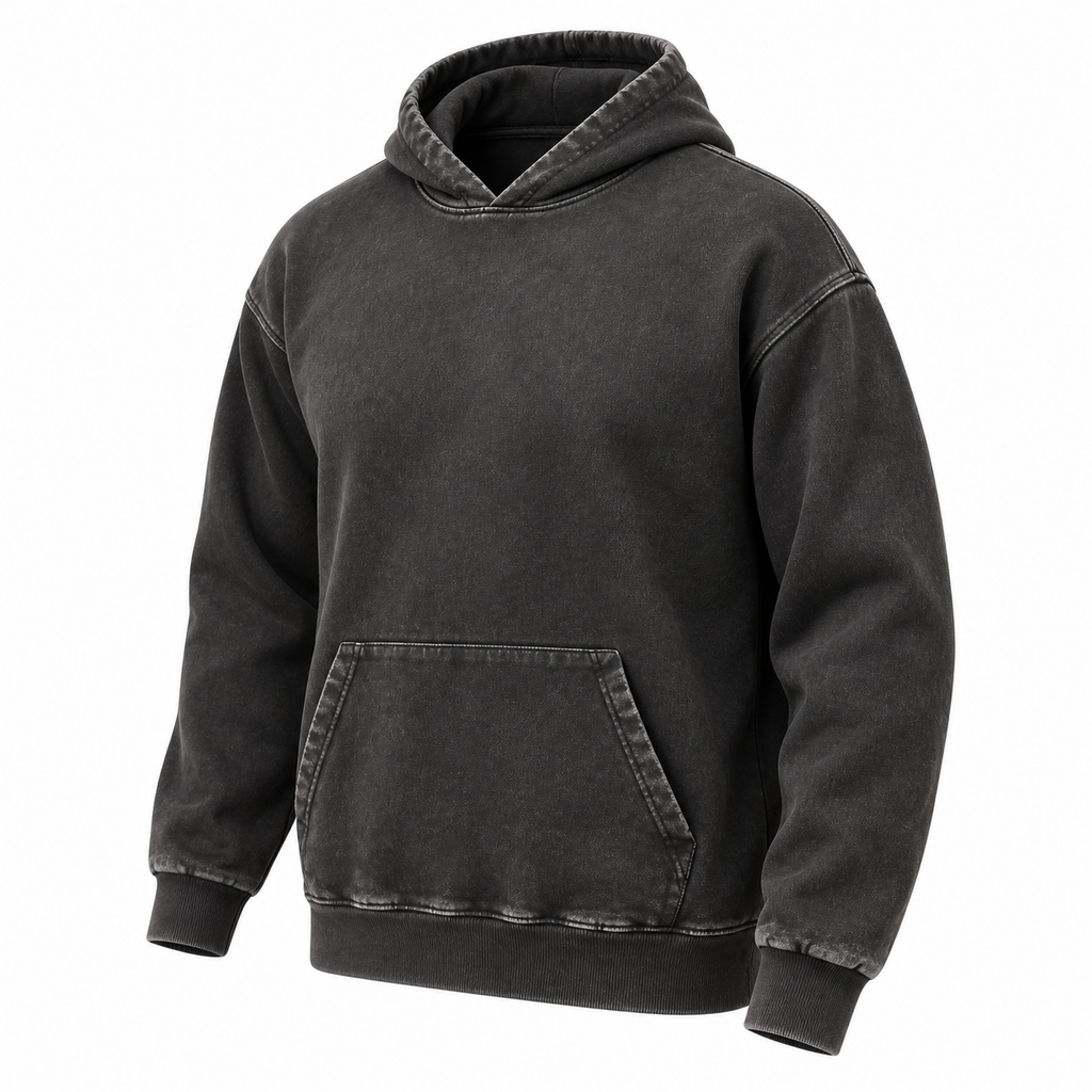 Three-quarter front view of a washed black pullover hoodie with a kangaroo pocket and ribbed cuffs and hem.