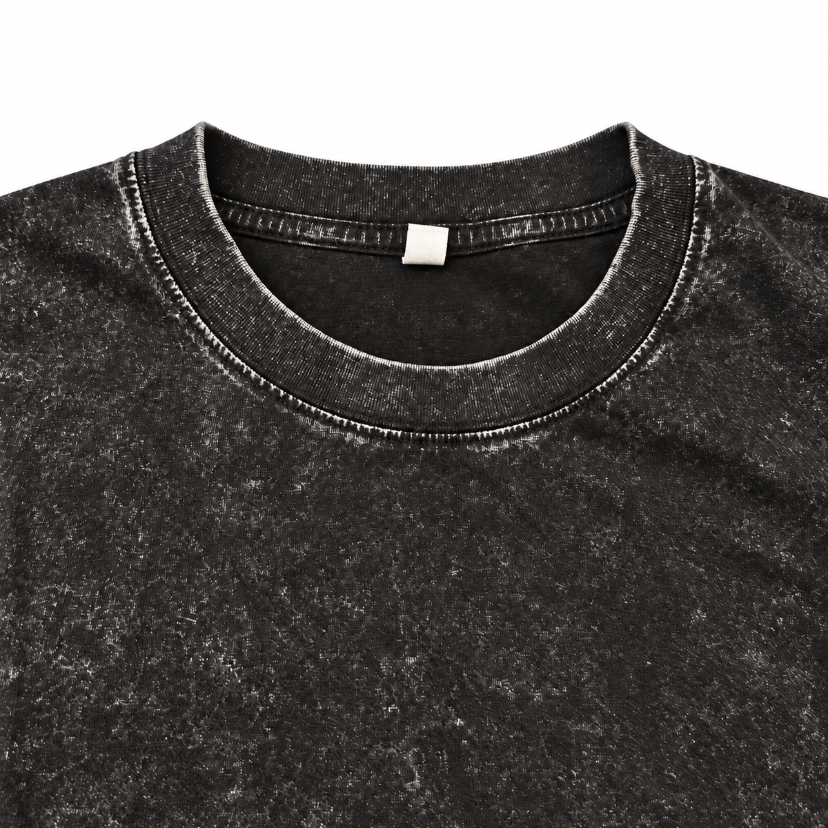 Close-up of the black washed crewneck T-shirt neckline and stitching.