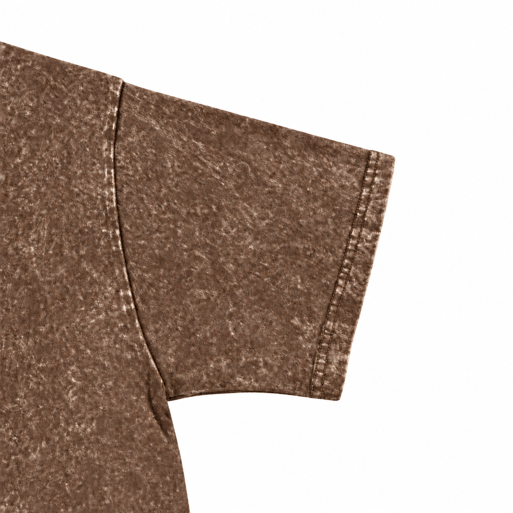 Close-up of the brown washed crewneck T-shirt sleeve and stitching.