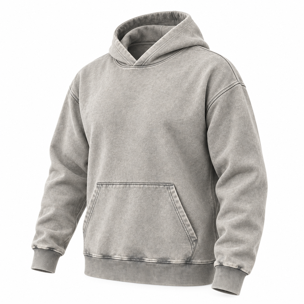 Three-quarter front view of a light grey washed pullover hoodie with a kangaroo pocket and ribbed cuffs and hem.