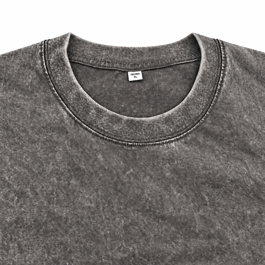 Close-up of the grey washed crewneck T-shirt neckline and stitching.